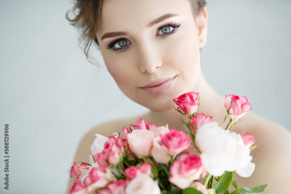 portrait of a beauty woman with a bouquet of flowers