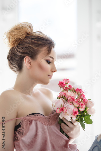 portrait of a beauty woman with a bouquet of flowers