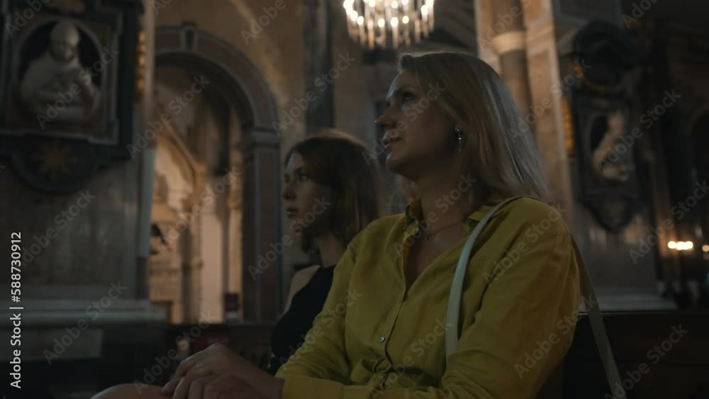 Family in a large Catholic cathedral. Family in a large Catholic cathedral.