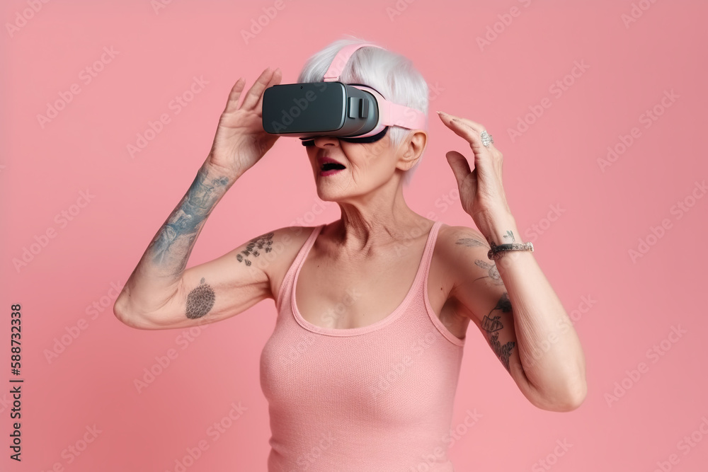 Portrait of smiling modern stylish senior woman in VR glasses against pink background. Portrait of smiling modern stylish senior woman in VR glasses against pink background.