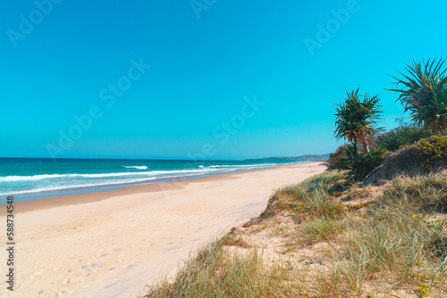 Beautiful wide panoramic view of the Peregian beach with rolling waves of Pacific ocean, Sunshine Coast, Queensland, Australia. © SeaRain
