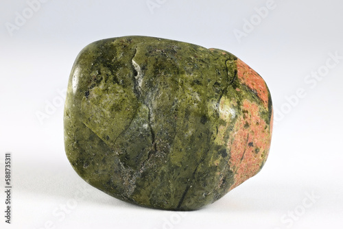 Unakite is an metamorphic rock that is altered granite composed of pink orthoclase feldspar, green epidote, and generally colorless quartz. photo