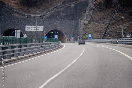 Tunnel entrance. Tunel do Marão is a road tunnel located in Portugal that connects Amarante to Vila Real, crossing the Serra do Marão. - Concept of hope, the light at the end of the tunnel.