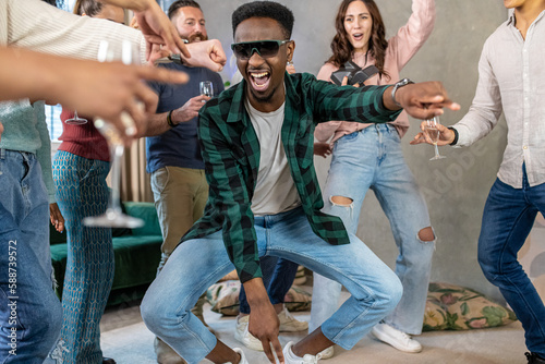 Принти на полотні Moment of extravagance of a young African American while having fun dancing, lar