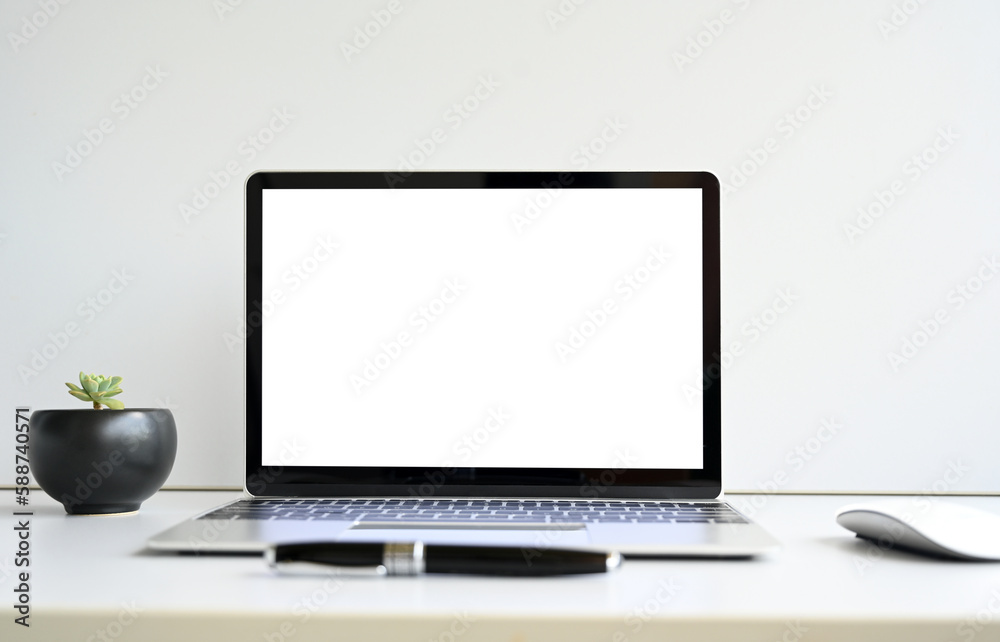 blank screen Modern laptop computer with mouse,Smart phone and Succulent on wood table in office view backgrounds blank screen Modern laptop computer with mouse,Smart phone and Succulent on wood table in office view backgrounds