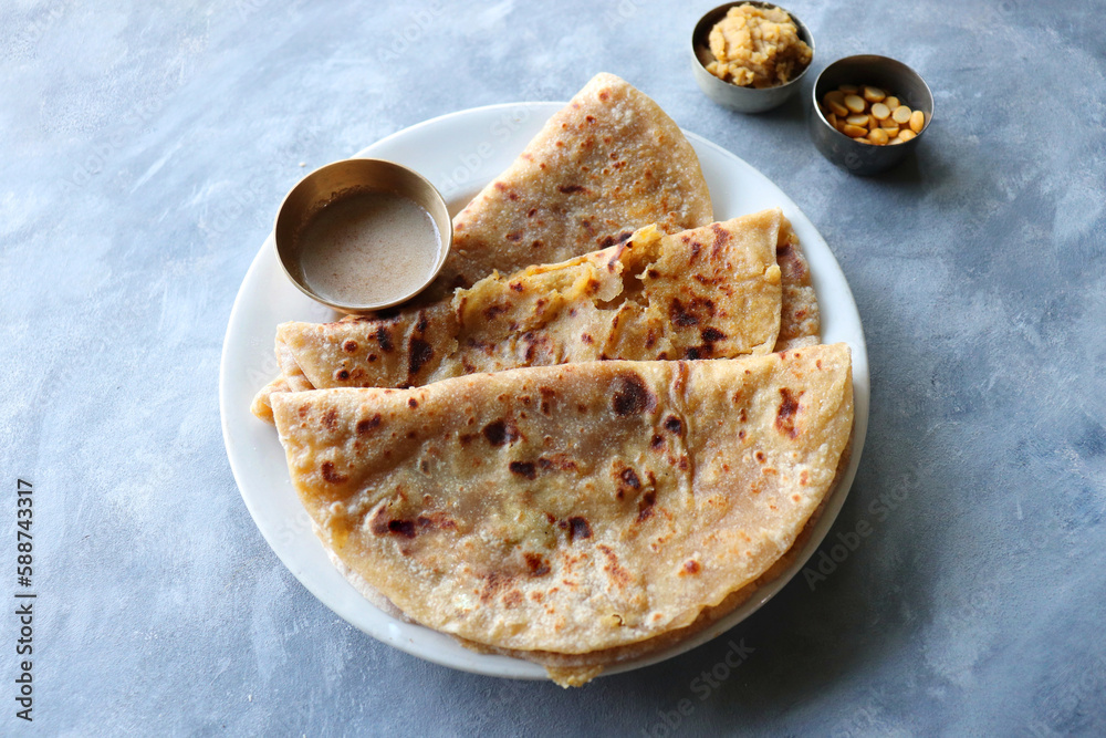 Foto Stock Puran Poli is an Indian sweet flatbread stuffed with chana