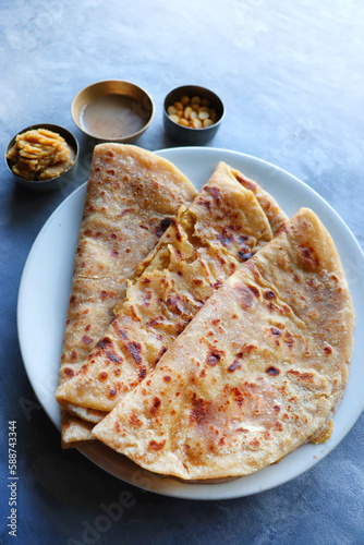 Puran Poli is an Indian sweet flatbread stuffed with chana dal, jaggery, ghee and cardamom and is usually eaten at Holi or Gudi Padva festival. Recipe ingredients. copy space. Healthy sweet dessert. photo