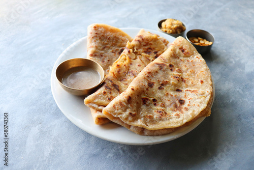Puran Poli is an Indian sweet flatbread stuffed with chana dal, jaggery, ghee and cardamom and is usually eaten at Holi or Gudi Padva festival. Recipe ingredients. copy space. Healthy sweet dessert.