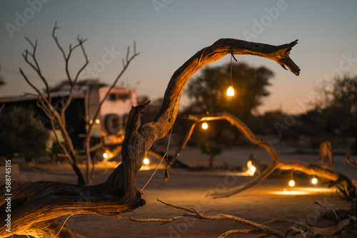 Photography Romantic Evening at African Campsite with Chain of lights
