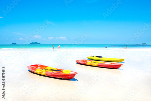 Summer at white sand beach and kayaks on a bright day © TWEESAK