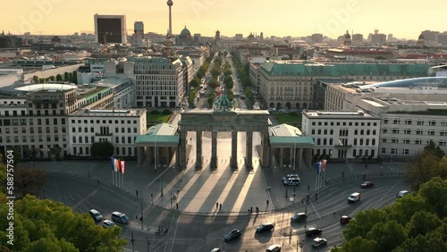 Aerial View of Brandenburg Gate (Brandenburger Tor) in the morning sunrise  - monument in Berlin, Capital of Germany photo
