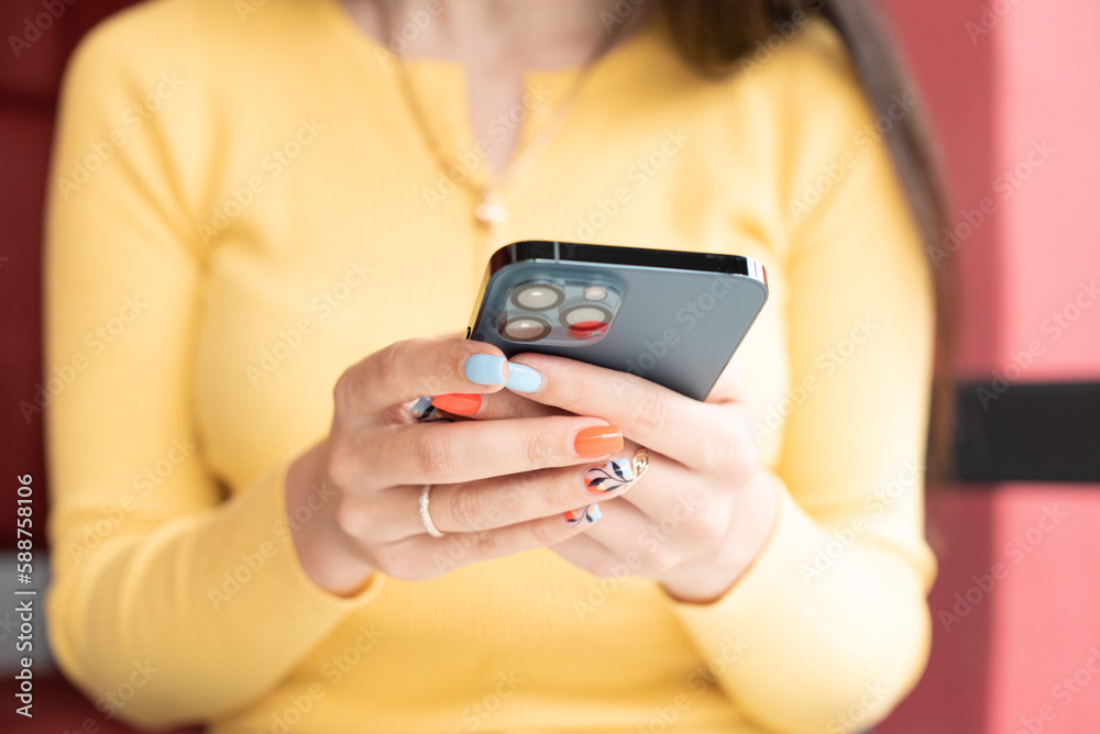 Smartphone usage, girl sits in cafe with coffee cup and surfs Internet. Distance work, social media . Smartphone usage, girl sits in cafe with coffee cup and surfs Internet. Distance work, social media .
