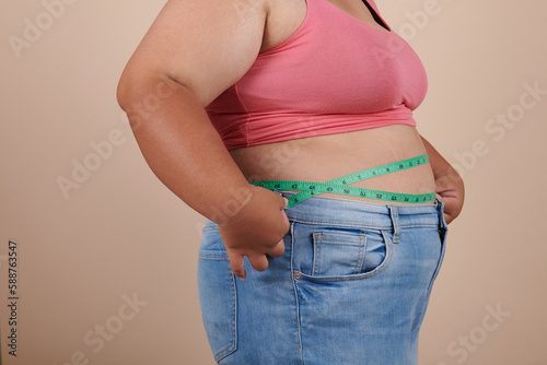 fat woman measuring her stomach, isolate on white background, she wants to lose weight concept. Positive lifestyle., Type with increased fat deposition and fullness