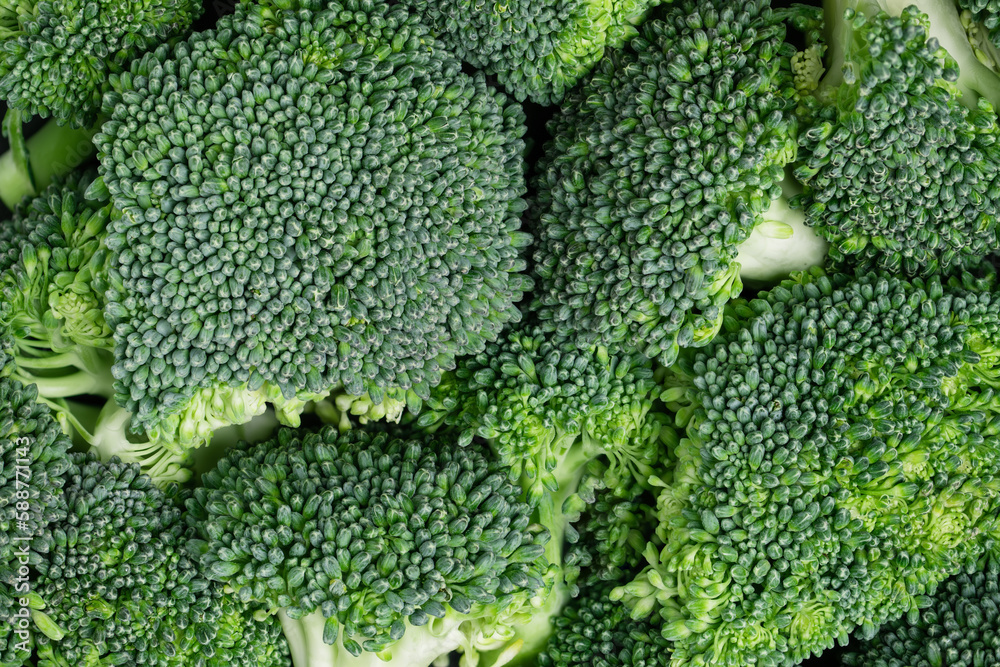 Broccoli slices top view closeup. Fresh broccoli cabbage background. Broccoli slices top view closeup. Fresh broccoli cabbage background.