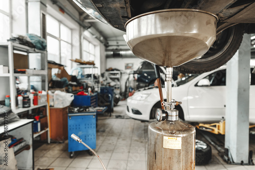Process of oil change in a car service