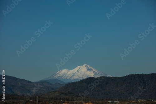 Afternoon snow covered view of the peak of Mount Shasta  from Redding  California  USA.