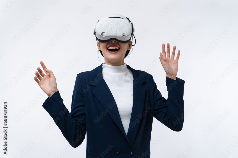 Happy young Asian businesswoman working in virtual reality environment in VR glasses touching virtual interface isolated on white background. Happy young Asian businesswoman working in virtual reality environment in VR glasses touching virtual interface isolated on white background.