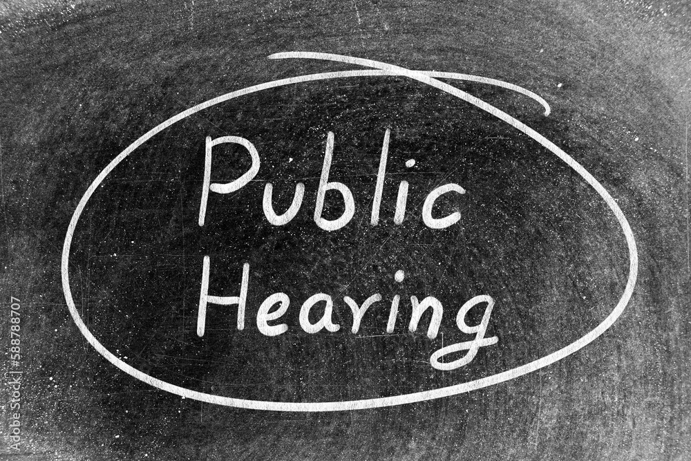 Fototapeta premium White chalk hand writing in word public hearing and circle shape on blackboard background