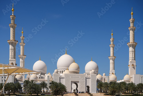 Sheikh Zayed Grand Mosque. Wide angle architecture landscape photo with this amazing landmark in Abu Dhabi during a sunny day with blue sky.