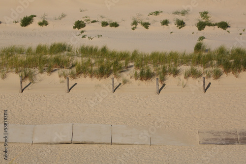 Plank footpath on the beach seen from above
