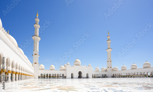 Sheikh Zayed Grand Mosque. Wide angle architecture landscape photo with this amazing landmark in Abu Dhabi during a sunny day with blue sky, view to interior courtyard.