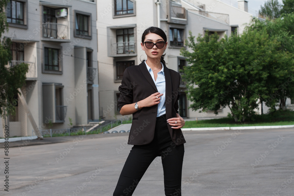 beautiful asian girl in classic suit posing outdoors beautiful asian girl in classic suit posing outdoors