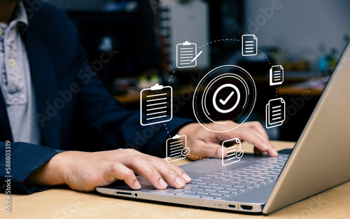 Konstfotografi Businessman using laptop with document icon and correct mark for standard qualit