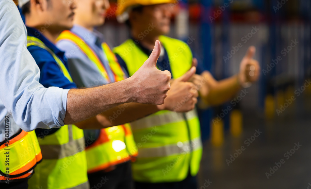 Thumb up. Unity and teamwork concept. team standing hands together. Professional Mechanical Engineer team Working at warehouse store. Thumb up. Unity and teamwork concept. team standing hands together. Professional Mechanical Engineer team Working at warehouse store.