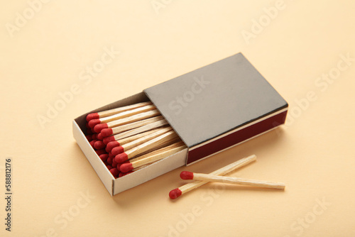 Box of matches on a beige background