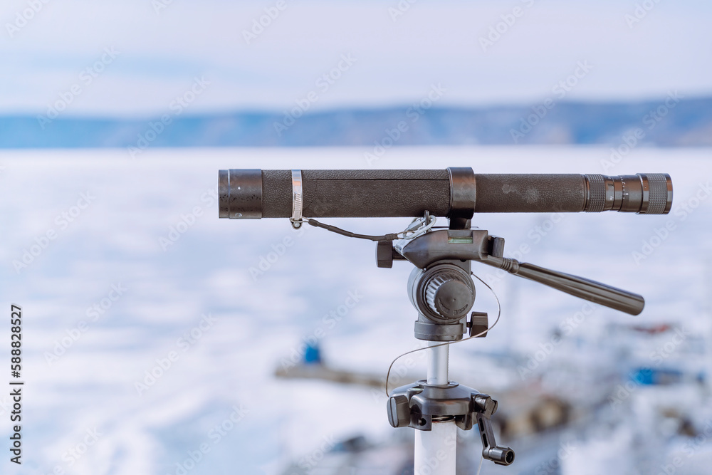 Telescope overlooking the beautiful winterlandscapes of lake Baikal