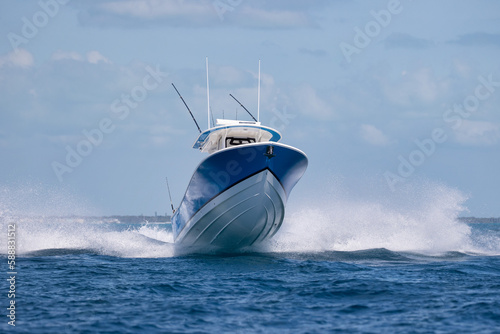 Speeding center console boat getting airborne.