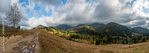 Autumn in mountain, amazing landscape with dirt road