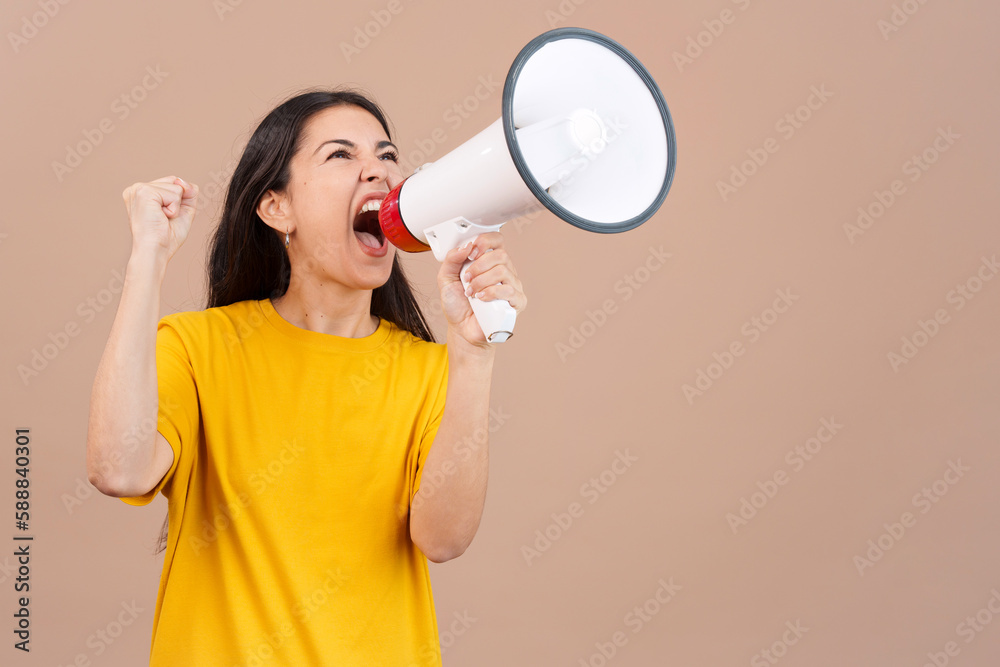 Upset caucasian woman yelling using a loudspeaker Upset caucasian woman yelling using a loudspeaker