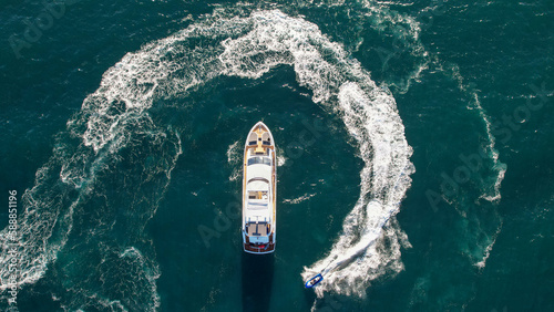 Yacht with Jet Ski Going Around It Overhead View