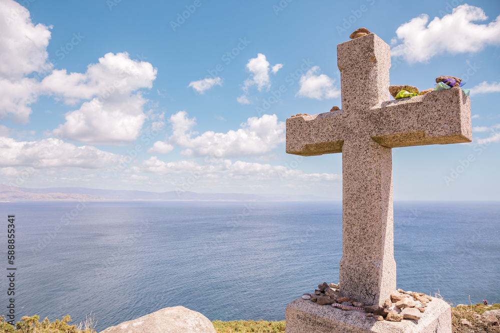 Views from the death coast in Finisterre, Galicia against a sky with clouds and blue sky.