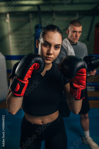 Portrait of a beautiful female boxer with gloves © cherryandbees