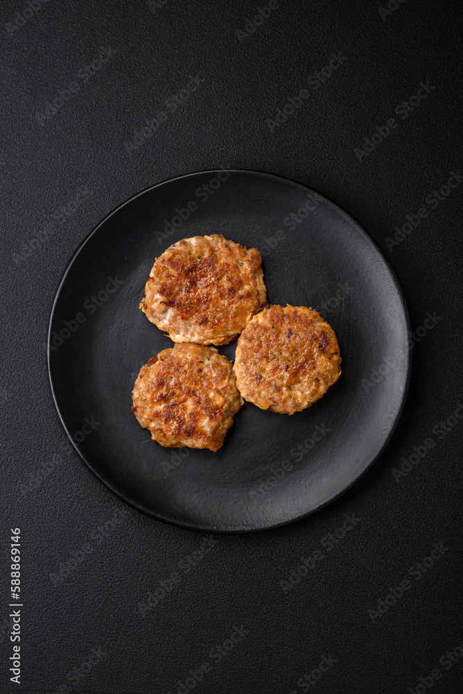 Delicious fresh fried minced fish cutlets with spices and herbs Delicious fresh fried minced fish cutlets with spices and herbs