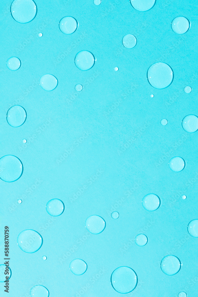 Bright pastel blue background with water and rain drops. Creative copy space. Minimal concept of water and hydration.