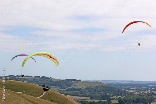  Paragliders flying from a hill 