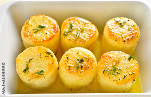 Fondant potatoes in baking dish