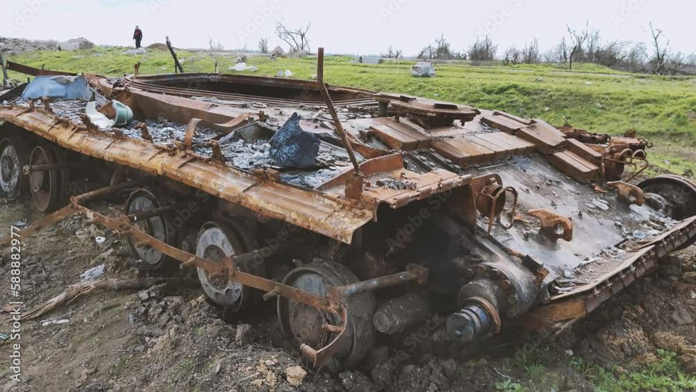 Russian tank destroyed by the Ukrainian military during the invasion of Ukraine. The remains of a blown up Russian tank in the Kherson region, Ukraine 2022 - 2023. The tank is covered with rust and Russian tank destroyed by the Ukrainian military during the invasion of Ukraine. The remains of a blown up Russian tank in the Kherson region, Ukraine 2022 - 2023. The tank is covered with rust and