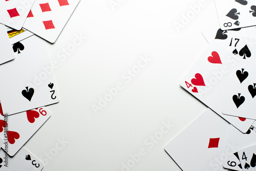 Scattered Cards Bordering the Right and Left on a White Background