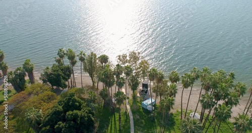 Aerial view of a beach with palms by the lake, Sea of Galilee, Israel.