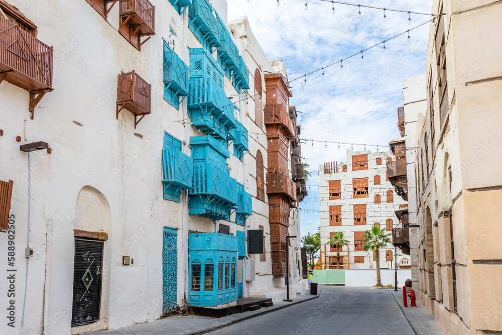 Obraz premium Al-Balad old town with traditional muslim houses with wooden windows and balconies, Jeddah, Saudi Arabia
