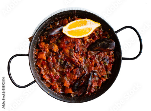 Delicious national Spanish dish is Paella with seafood, made from delicious rice with the addition of saffron. Isolated over white background