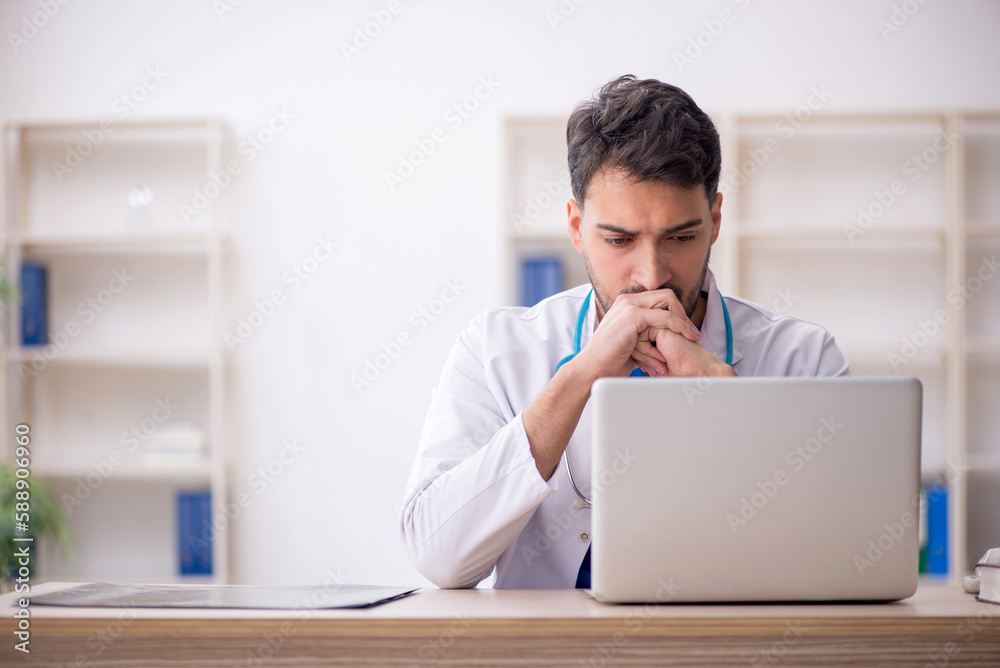 Young male doctor in telemedicine concept