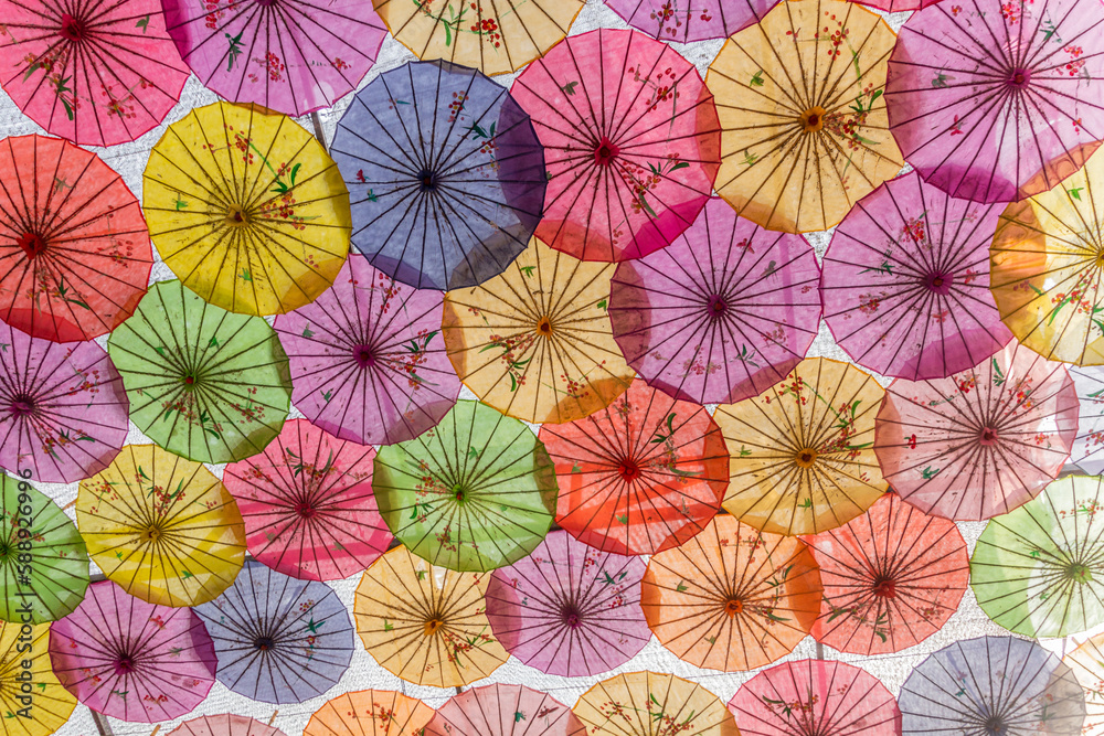 Colorful umbrellas covering a courtyard in China