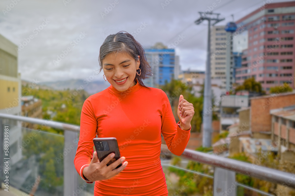 Surprised Latina Woman Reacting to Notification on Her Cellphone