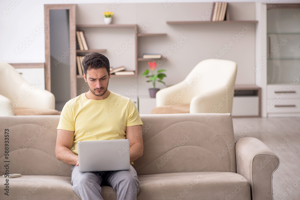 Young man working from home during pandemic Young man working from home during pandemic