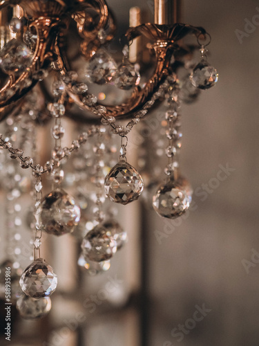 Vintage chandelier, romantic dark tone, crystals shining,gray background